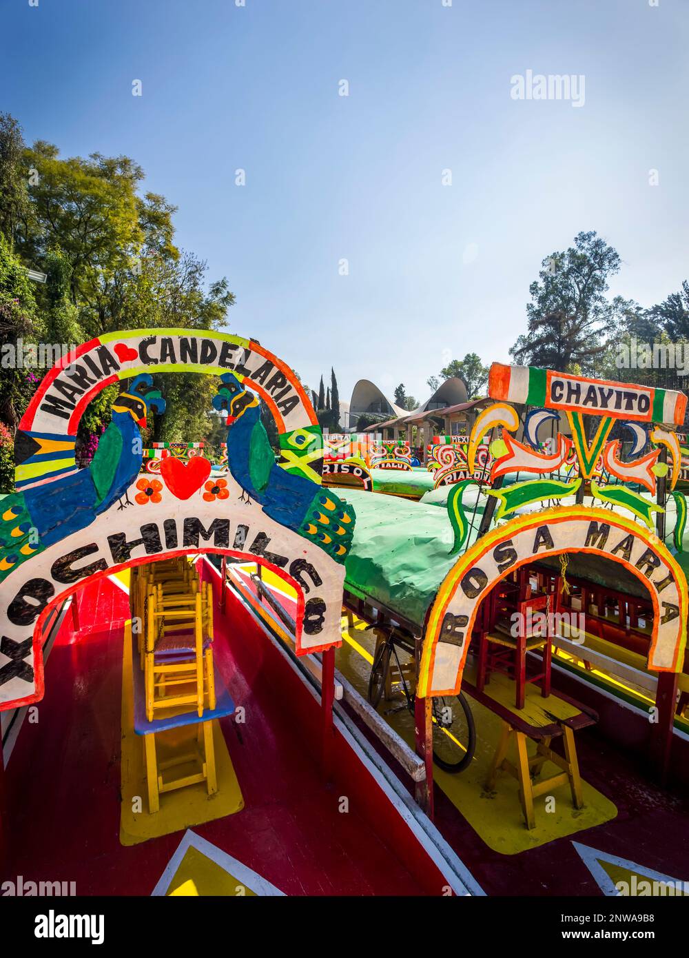 Mexico City, Mexico, January 13, 2015. Colorful trajinera boats at the shore of the system of canals known in Mexico City as  Xochimilco. Stock Photo