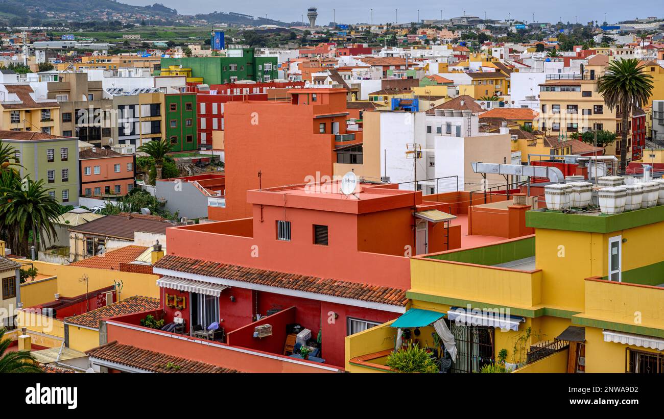 Vibrant apartment blocks fill the view over San Cristobal de La Laguna towards Tenerife North Airport. Stock Photo