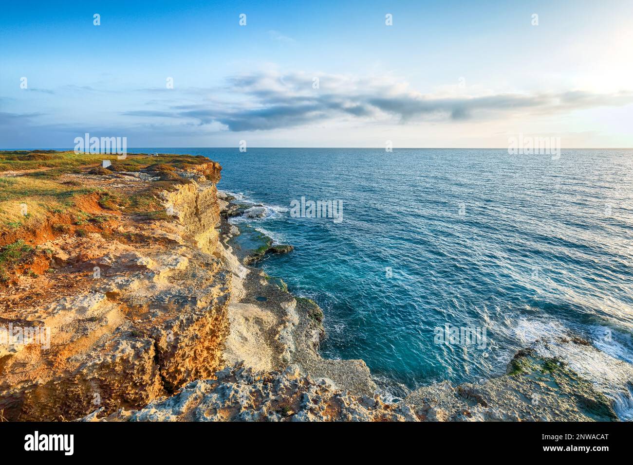 Stunning seascape with cliffs rocky arch and stacks (faraglioni) at Torre Sant Andrea, Salento coast, Puglia region, Italy Stock Photo