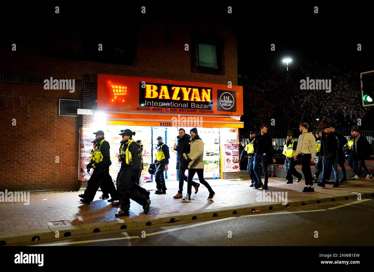 Police escort fans to the stadium ahead of the Sky Bet Championship match  at Kenilworth Road, Luton. Picture date: Tuesday February 28, 2023 Stock  Photo - Alamy