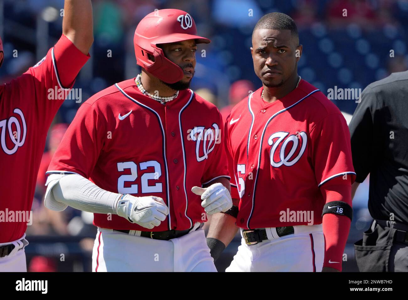 Washington Nationals' Dominic Smith (22) stands with teammate Victor Robles  after being hit by a pitch during the fourth inning of a spring training  baseball game against the St. Louis Cardinals Tuesday