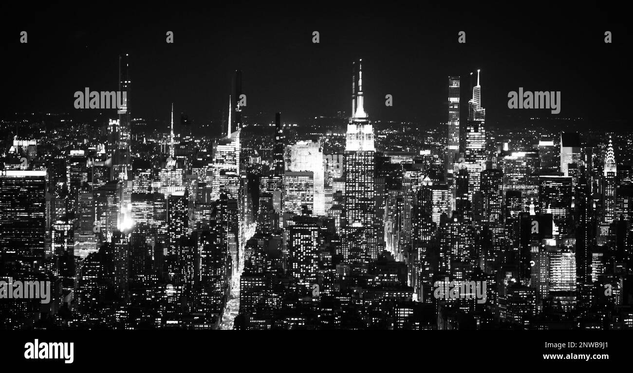 Aerial view over Manhattan with Empire State building by night - travel photography Stock Photo