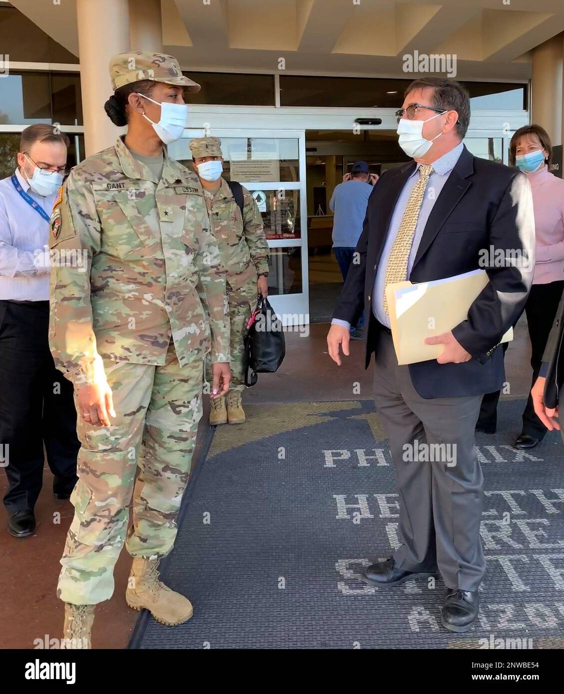 U.S. Army Corps of Engineer South Pacific Division Commander Brig. Gen. Antoinette Gant, left, John Drake, chief of the Corps’ Los Angeles District International and Interagency Services, right, discuss current and future VA Medical Center projects during a tour of the Carl T. Hayden VA Medical center Feb. 2 in Midtown Phoenix. Stock Photo
