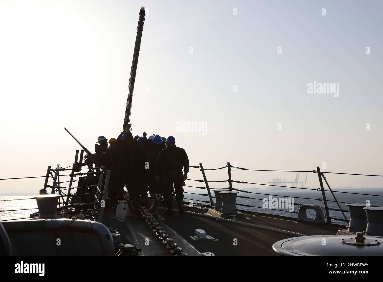 230127-N-JO162-1012 HAIFA, Israel (Jan. 27, 2023) Sailors assigned to guided missile destroyer USS Truxtun (DDG 103) raise the jack-staff while pulling into Haifa, Israel, during a scheduled port visit, Jan. 27, 2023. Truxtun is deployed to U.S. 5th Fleet to help ensure maritime security and stability in the Middle East region. Stock Photo
