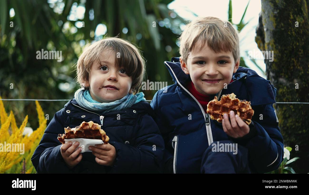 Two brothers eating meal hi-res stock photography and images - Alamy