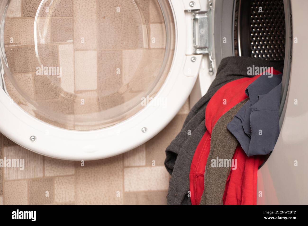 things in the washing machine, washing machine with things at home in