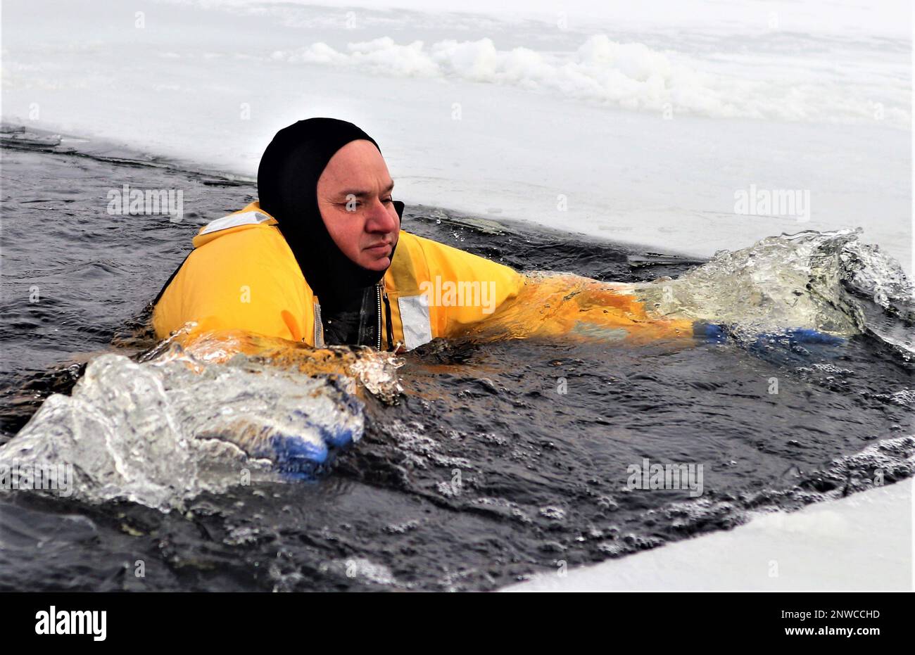 A firefighter wearing a cold-water immersion protective suit acts as a ...