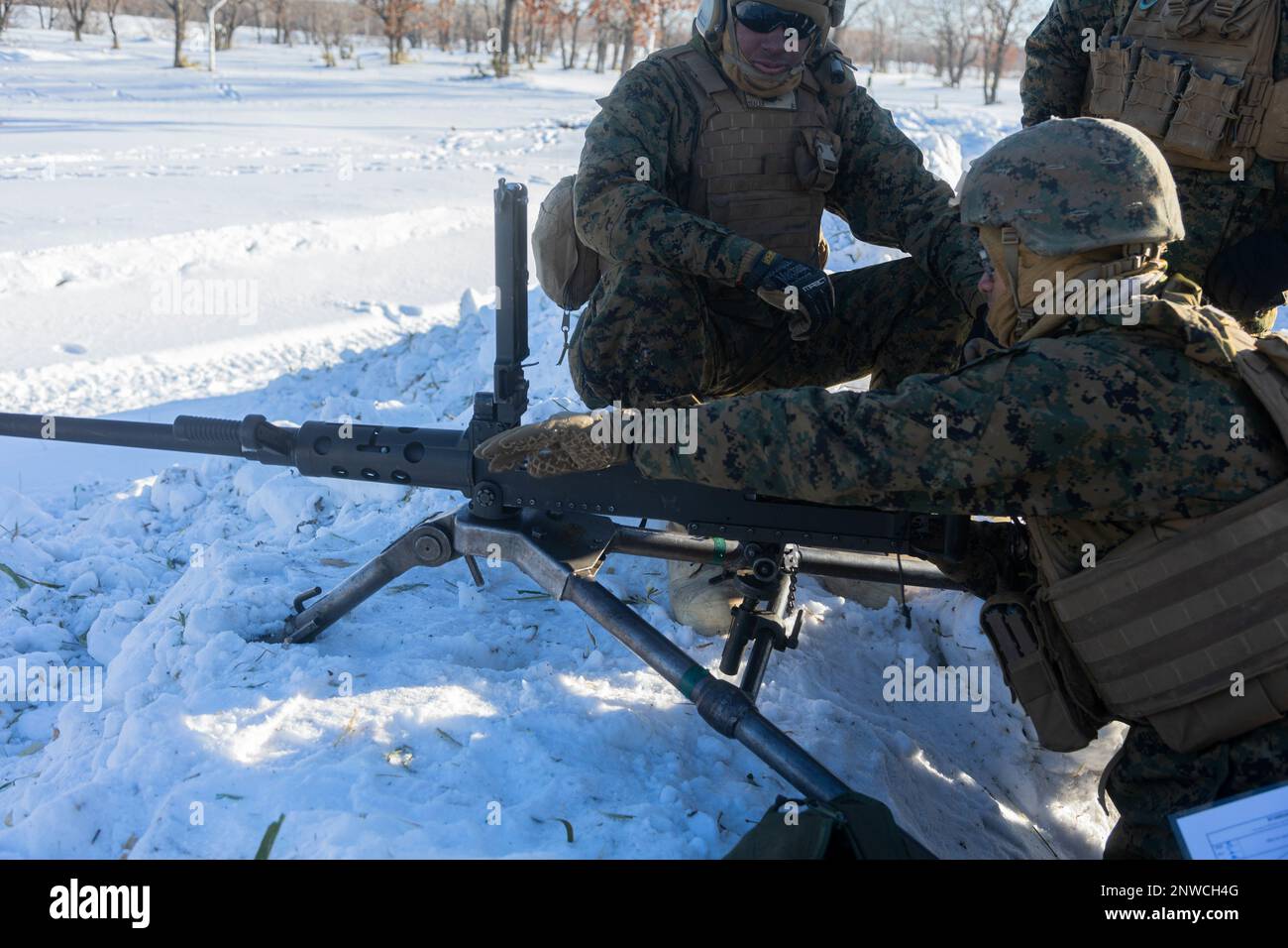 U.S. Marines with 3d Battalion, 12th Marines clear an M2A1 machine gun during Artillery Relocation Training Program 22.4 at the Yausubetsu Maneuver Area, Hokkaido, Japan, Jan. 28, 2023. The skills developed at ARTP increase the proficiency and readiness of the only permanently forward-deployed artillery unit in the Marine Corps, enabling them to provide precision indirect fires. Stock Photo