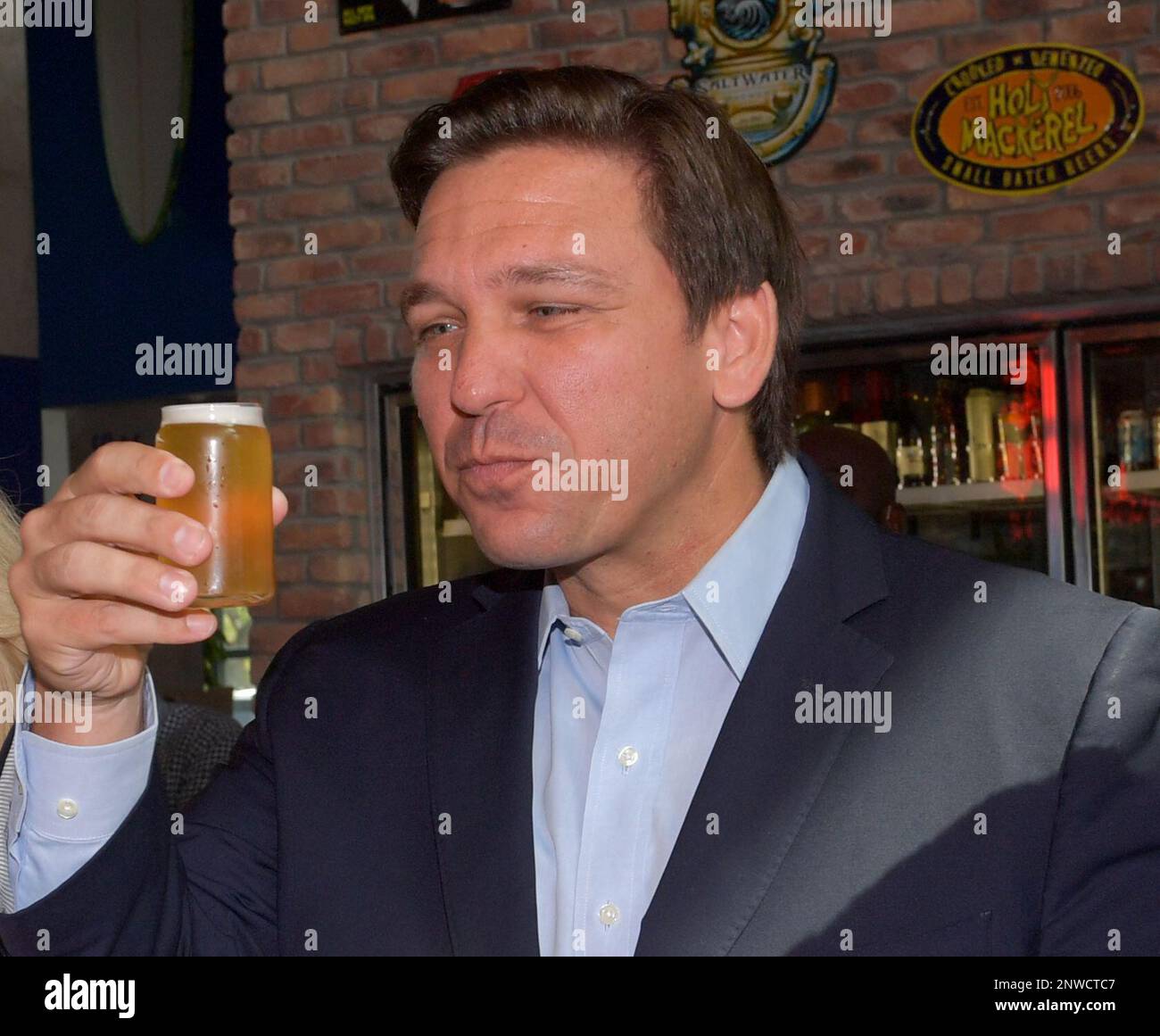 DELRAY BEACH, FL APRIL 24 Florida Governor Ron DeSantis makes a toast with his beer as he