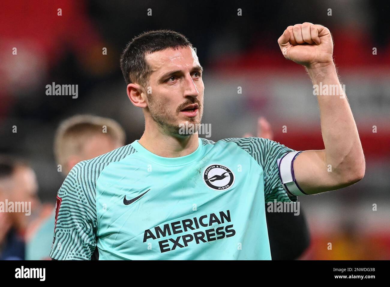 Lewis Dunk #5 of Brighton & Hove Albion celebrates his sides win with the fans during the Emirates FA Cup Fifth Round match Stoke City vs Brighton and Hove Albion at Bet365 Stadium, Stoke-on-Trent, United Kingdom, 28th February 2023  (Photo by Craig Thomas/News Images) Stock Photo
