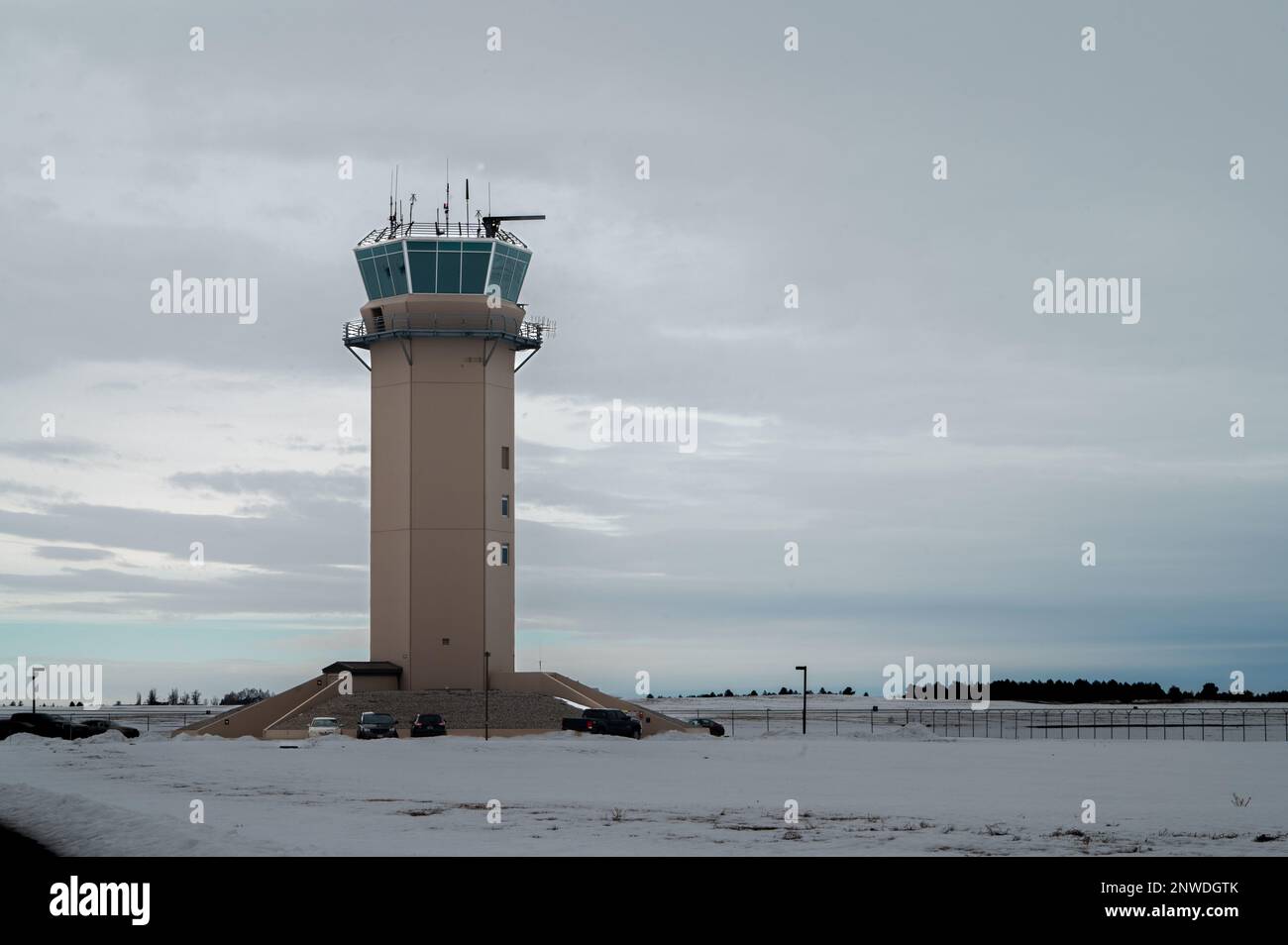 A U.S. Air Force air traffic control tower overlooks the airfield at ...