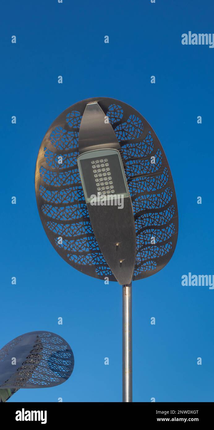 LED street lamp against the blue sky. Modern LED lights in the city, street lighting Stock Photo