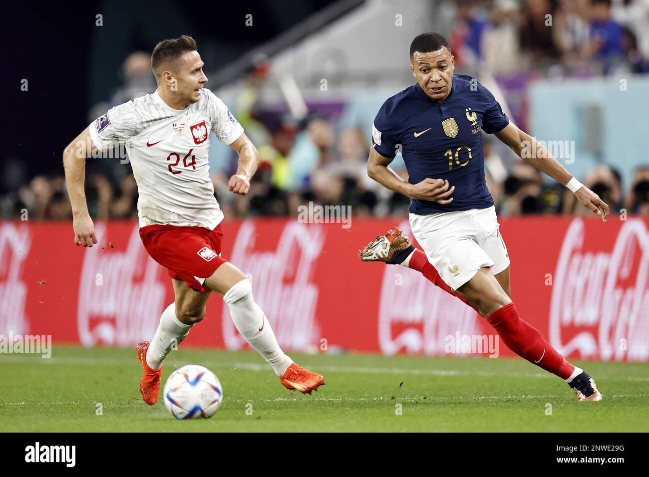 DOHA LR Przemyslaw Frankowski Of Poland Kylian Mbappe Of France doha-lr-przemyslaw-frankowski-of-poland-kylian-mbappe-of-france