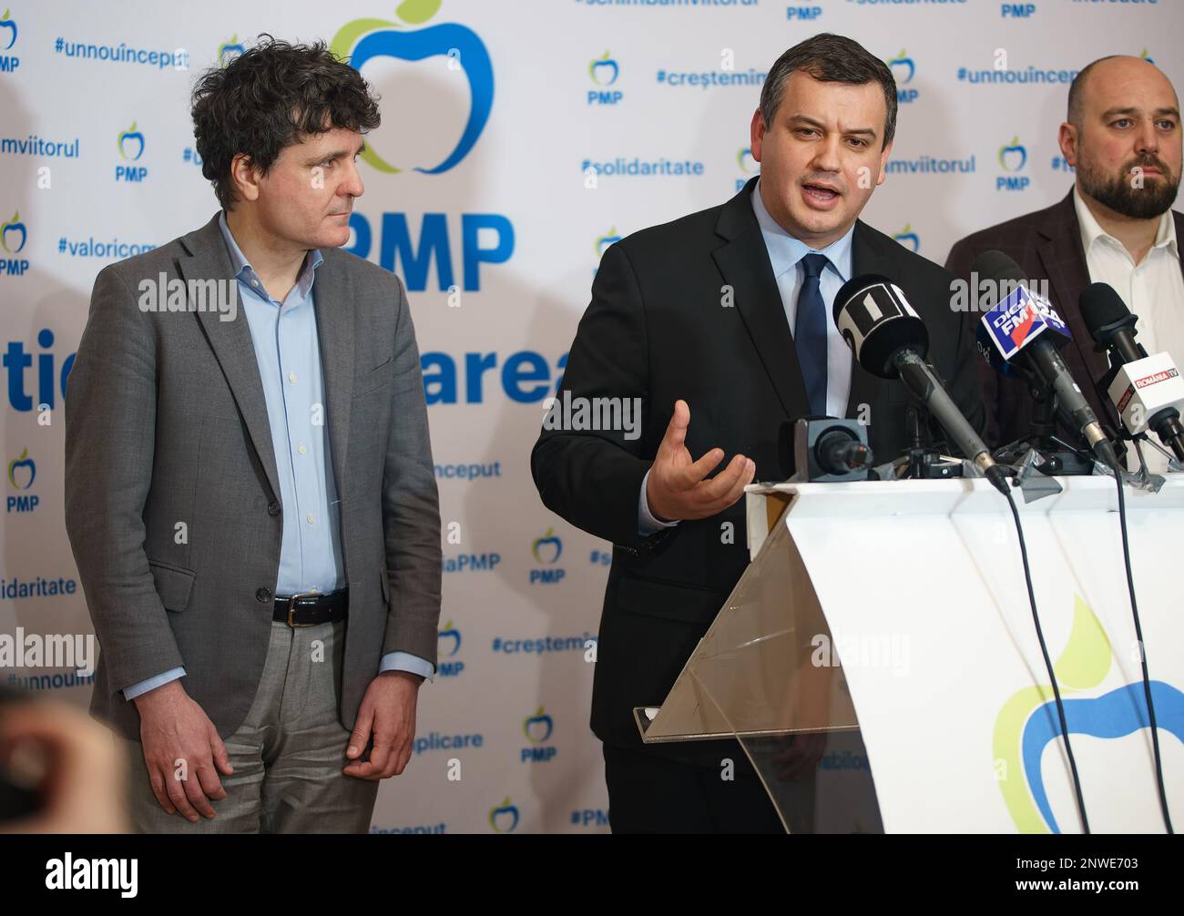 Bucharest, Romania. 28th Feb, 2023: Nicușor Dan (L), the general mayor of Bucharest, listens to the speech of the president of the Popular Movement Party, MEP Daniel Tomac (C), who let it be understood that he will support Dan in the next electoral campaign in 2024, during a press conference after their first meeting politics. Credit: Lucian Alecu/Alamy Live News Stock Photo
