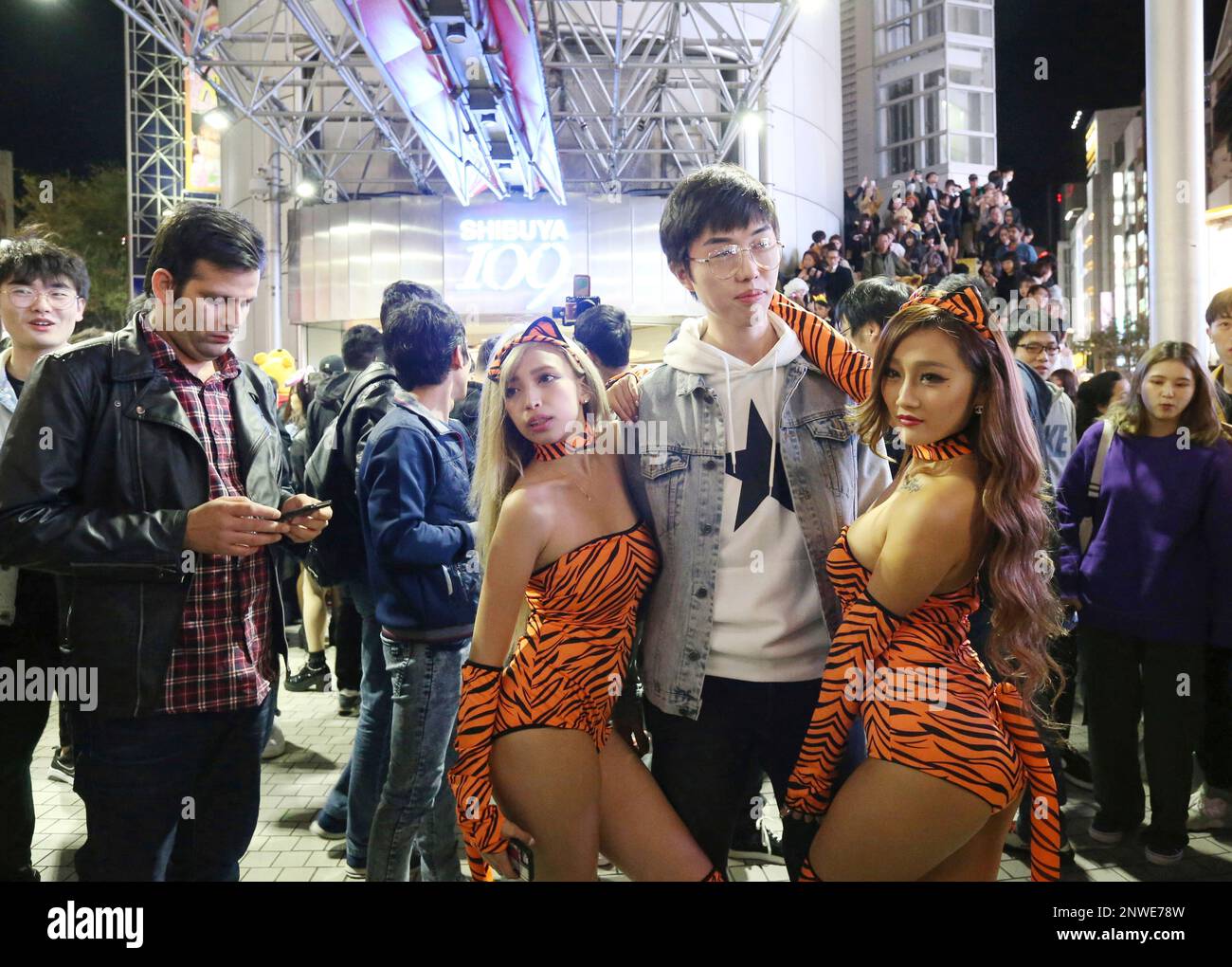 People dressed in Halloween costumes march around Shibuya Crossing or  SHIBUYA109 in Shibuya Ward, Tokyo to celebrate Halloween day on October 31,  2018. Many young people clad in topical news or famous