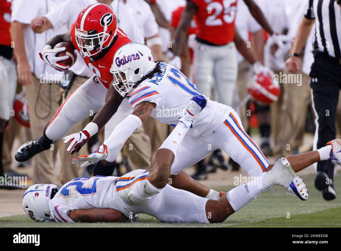 Georgia wide receiver Riley Ridley (8) tries to avoid a tackle from ...