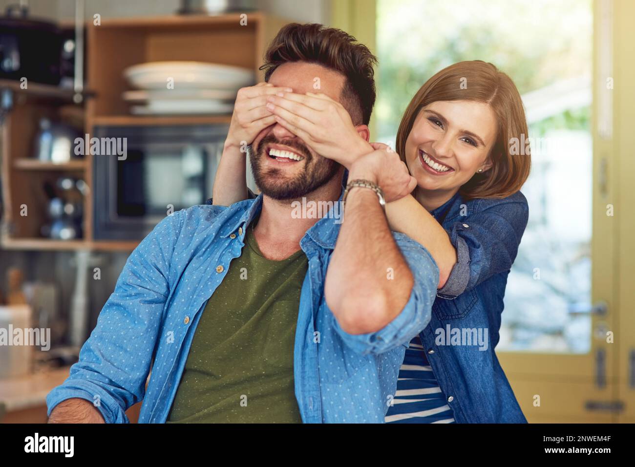 Think he knows its me. Portrait of a happy young woman playfully