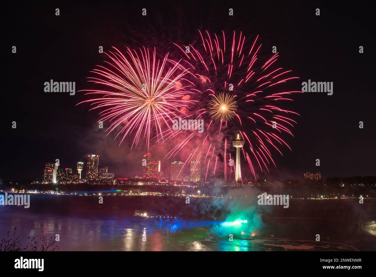 Fireworks seen over Niagara Falls in summer time at night on the United States side of the