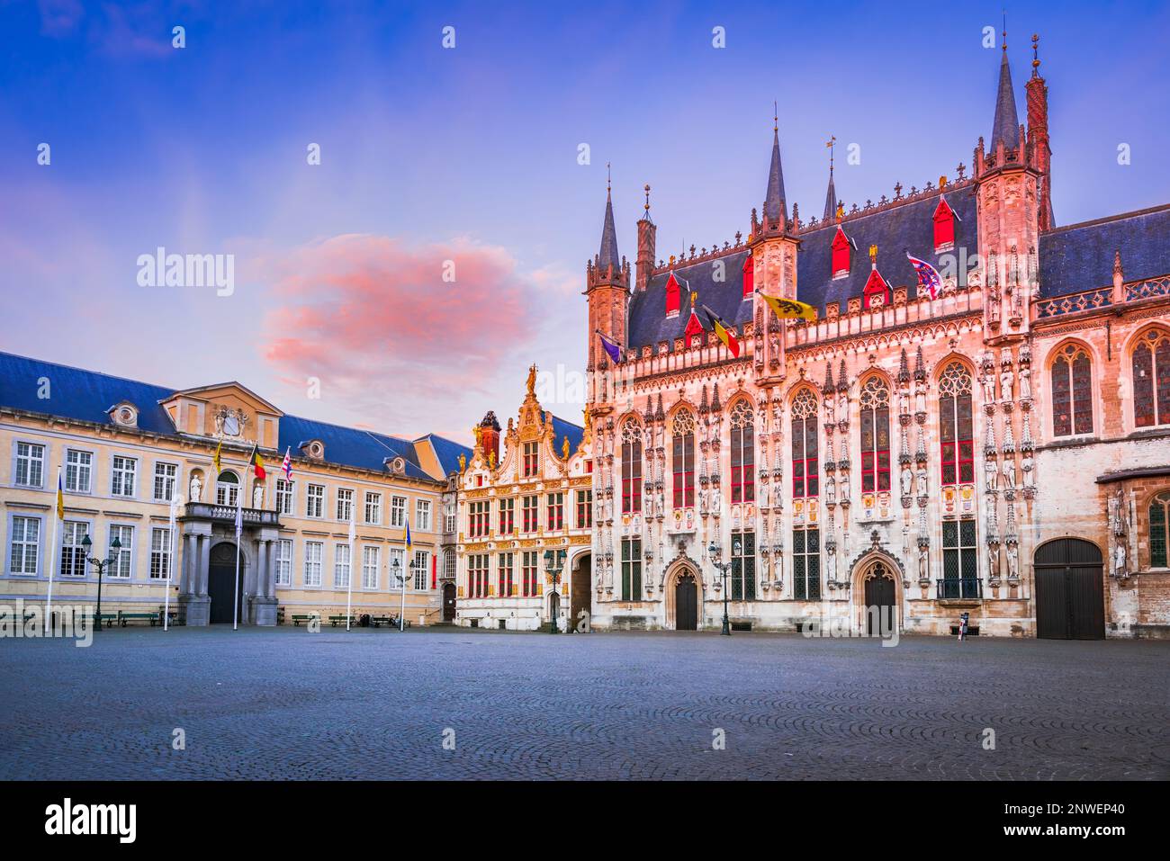 Burg Square is the historic heart of Bruges, Belgium, with picturesque Gothic and Renaissance buildings, including the stunning Stadhuis beautifully l Stock Photo