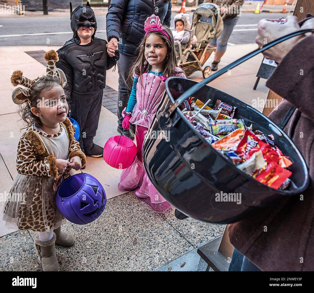 Grace Cusson as a giraffe, recites her trick or treat and is rewarded