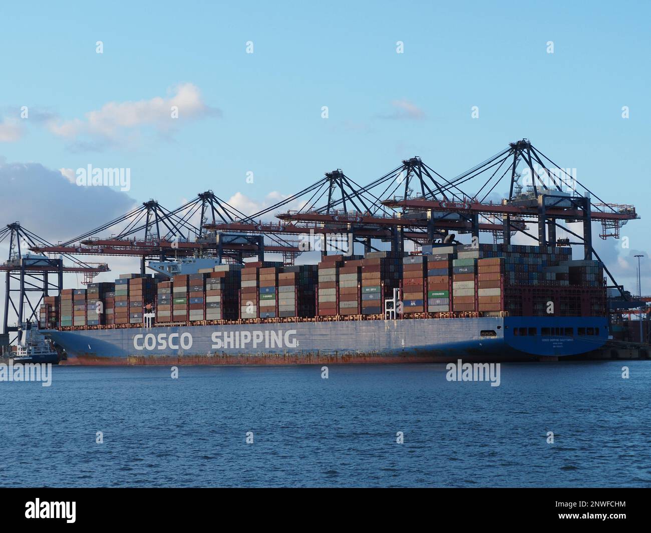 The Cosco shipping 'Sagittarius' can transport around 20.000 containers. Port of Rotterdam, the Netherlands. Stock Photo