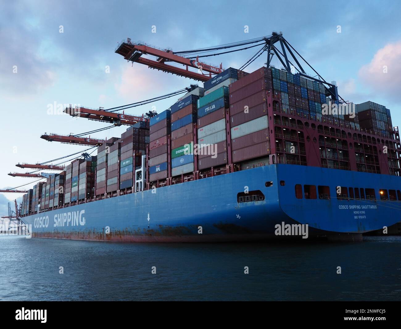 Close up of the enormous Cosco shipping 'Sagittarius' that can carry around 20.000 containers, in the deep sea port of Rotterdam, the Netherlands Stock Photo