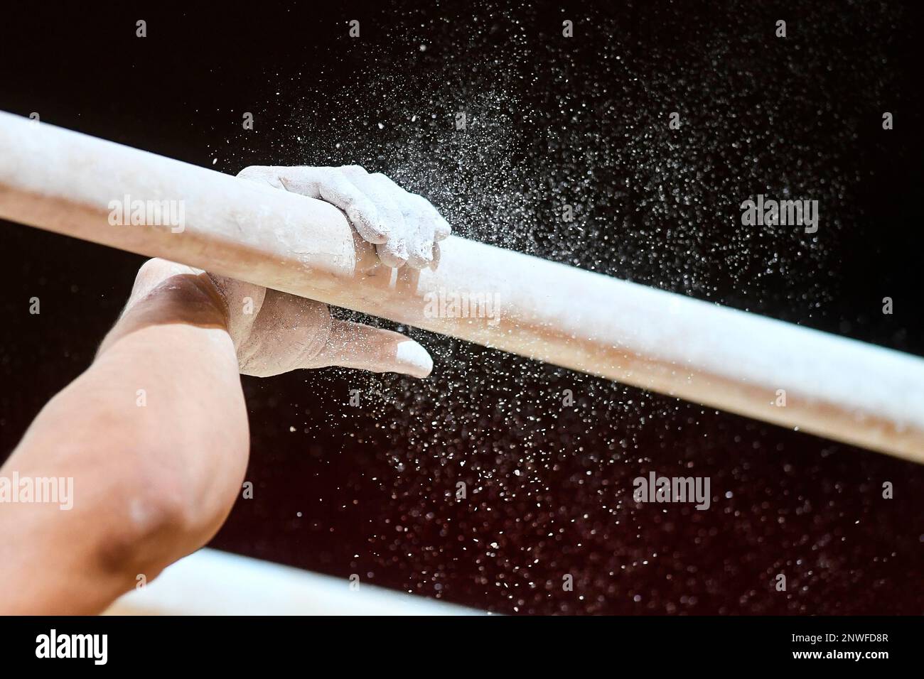 October 21, 2018 Doha, Qatar A gymnast chalks up the parallel bars
