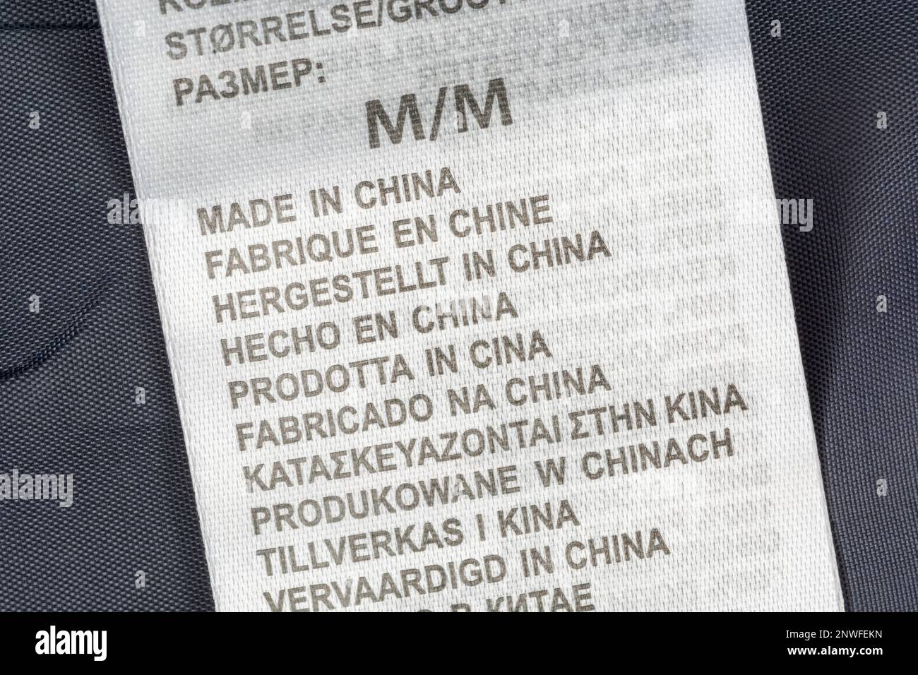 Made in China garment label in multiple languages. For Chinese textile