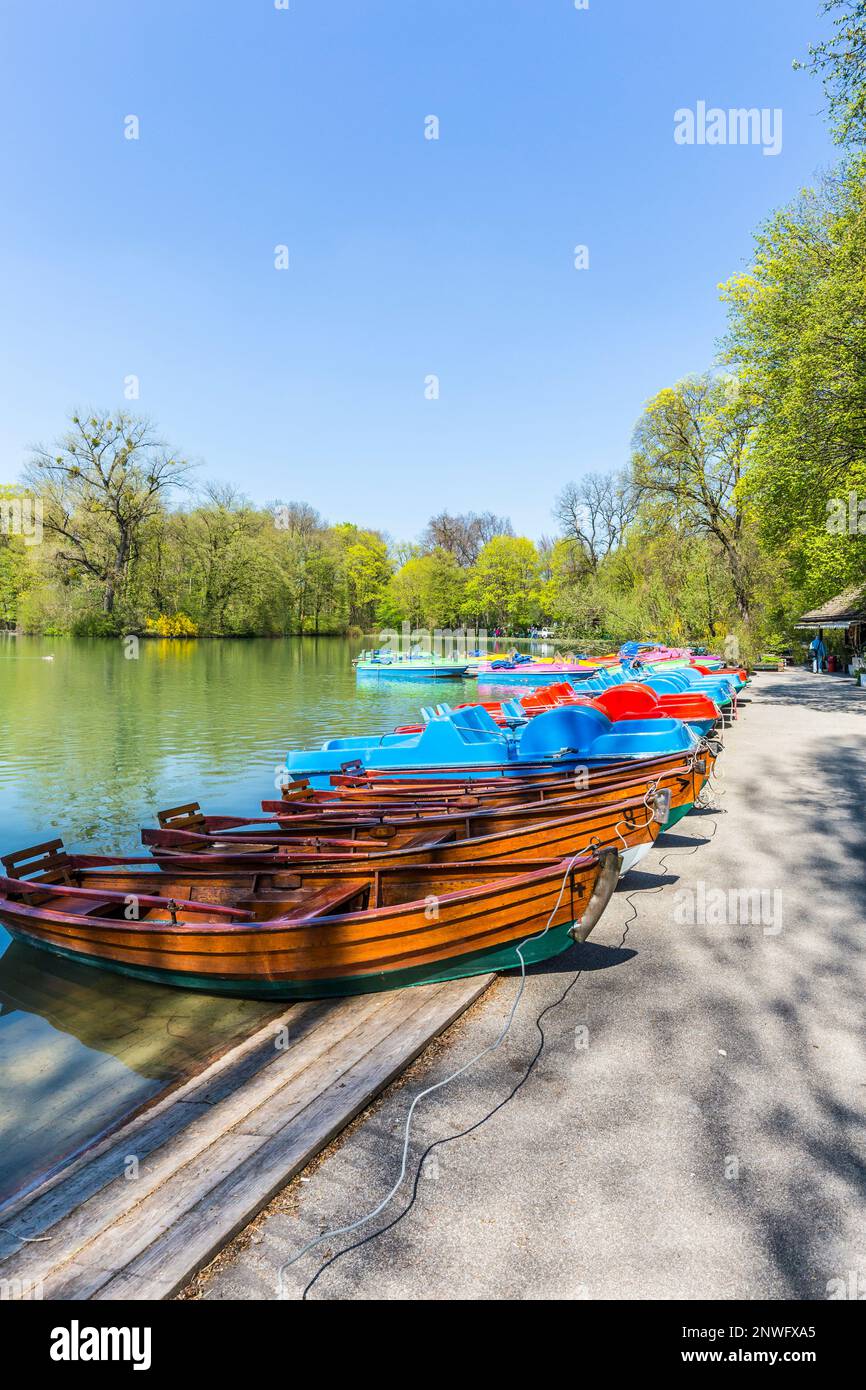 boats for rent at the  Seehaus in Munich, Germany. This pier is placed at the Kleinhesseloher lake in the English Garden. Stock Photo