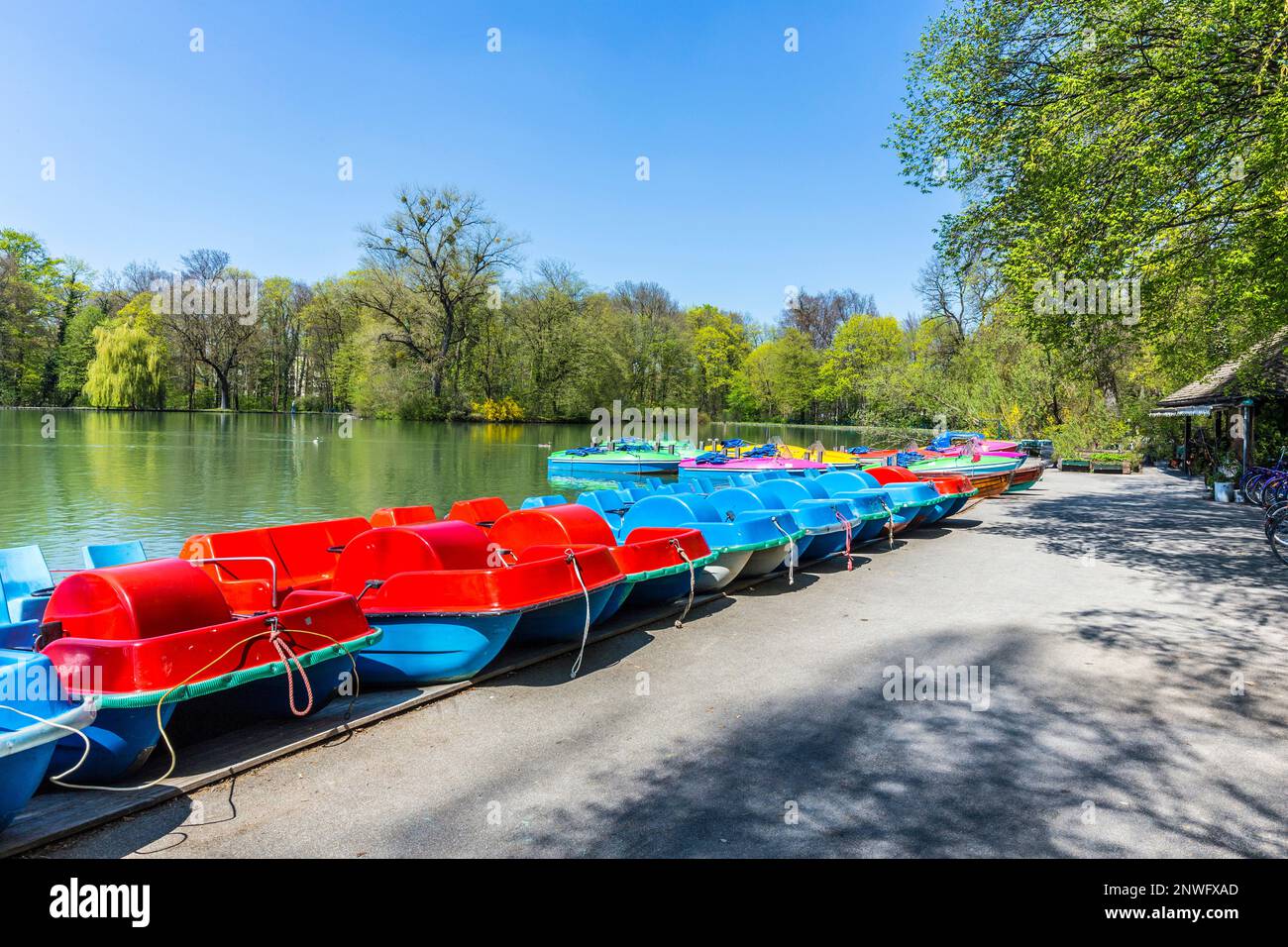 boats for rent at the  Seehaus in Munich, Germany. This pier is placed at the Kleinhesseloher lake in the English Garden. Stock Photo