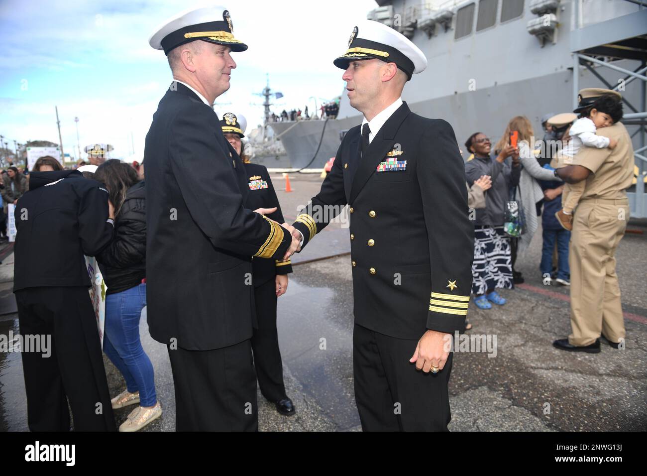 230212-N-DB801-0041  MAYPORT, Fla. – (Feb. 12, 2023) -- Rear Adm. Jim Aiken, Commander, U.S. Naval Forces Southern Command/U.S. 4th Fleet, left, welcomes home Cmdr. James Diefenderfer, Jr., Commanding Officer, USS The Sullivans (DDG 68), following the ship’s return from a four-month deployment to Naval Station Mayport, Fla., Feb. 12, 2023. Aiken presented Diefenderfer with a Meritorious Unit Commendation (MUC) medal for his ship’s sustained superior performance from Oct. 26, 2022 to Jan. 22, 2023, having consistently provided a combat-ready force to U.S. Central Command, deployed in response t Stock Photo