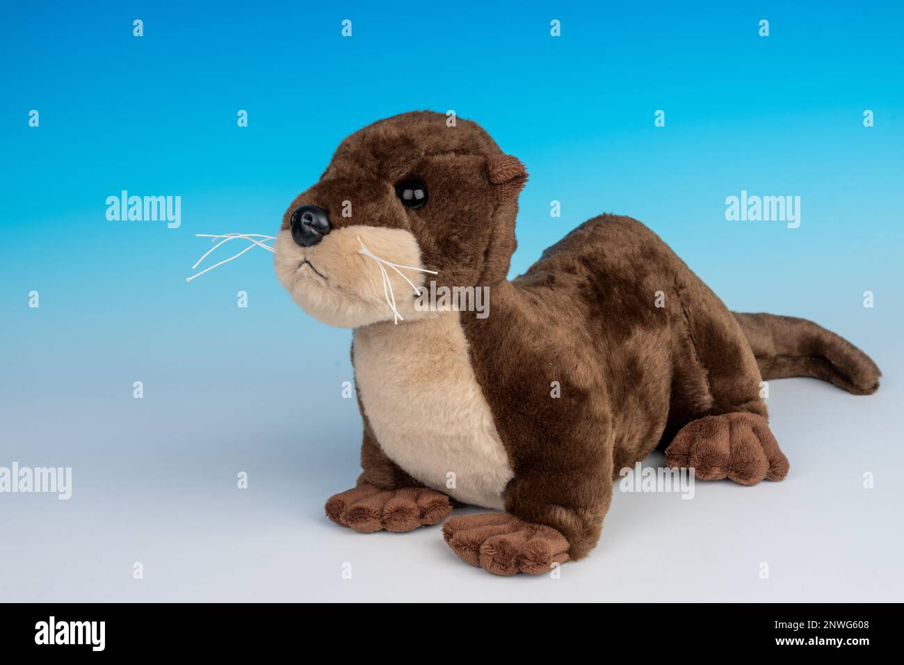 River Otter stuffed animal on a blue and white seamless background