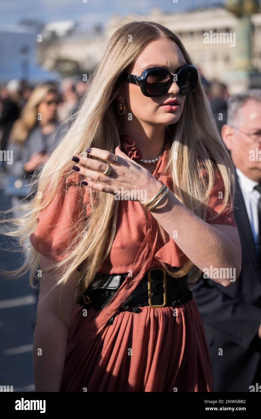 Romee Strijd poses for photographers upon arrival at the Christian Dior
