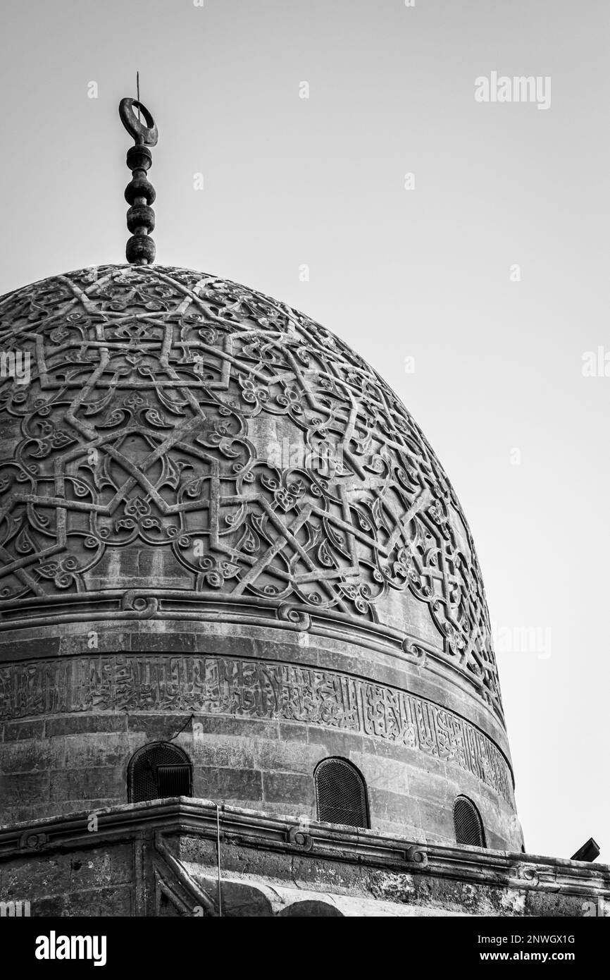 A black and white of large dome and word in Islamic font Stock Photo