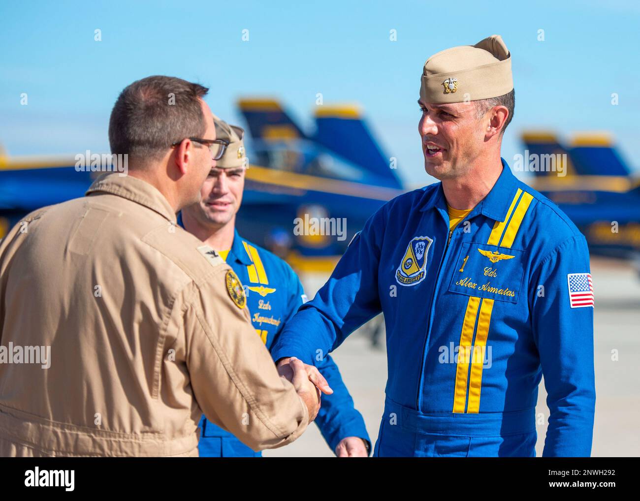 Cmdr. Alex Armatas, commanding officer and flight leader of the U.S. Navy Flight Demonstration Squadron, the Blue Angels, right, meets base leadership upon arrival to Naval Air Facility (NAF) El Centro. The Blue Angels are currently conducting winter training at NAF El Centro, California, in preparation for the upcoming 2023 air show season. Stock Photo