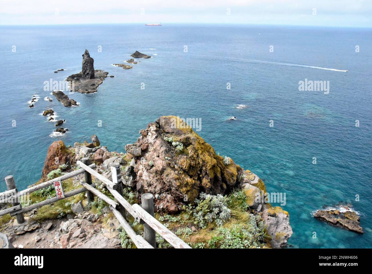 A photo shows the Kamui Rock(Above L) at the tip of the Cape Kamui ...