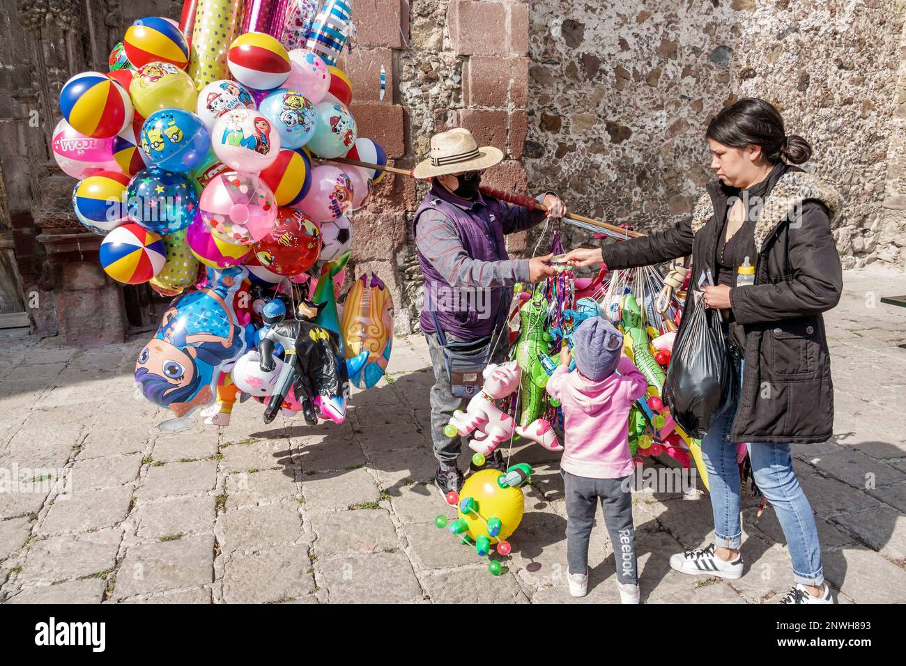 San Miguel de Allende Guanajuato Mexico,Historico Central historic center Zona Centro,wearing sombrero hat,street vendor vendors selling,balloons ball Stock Photo