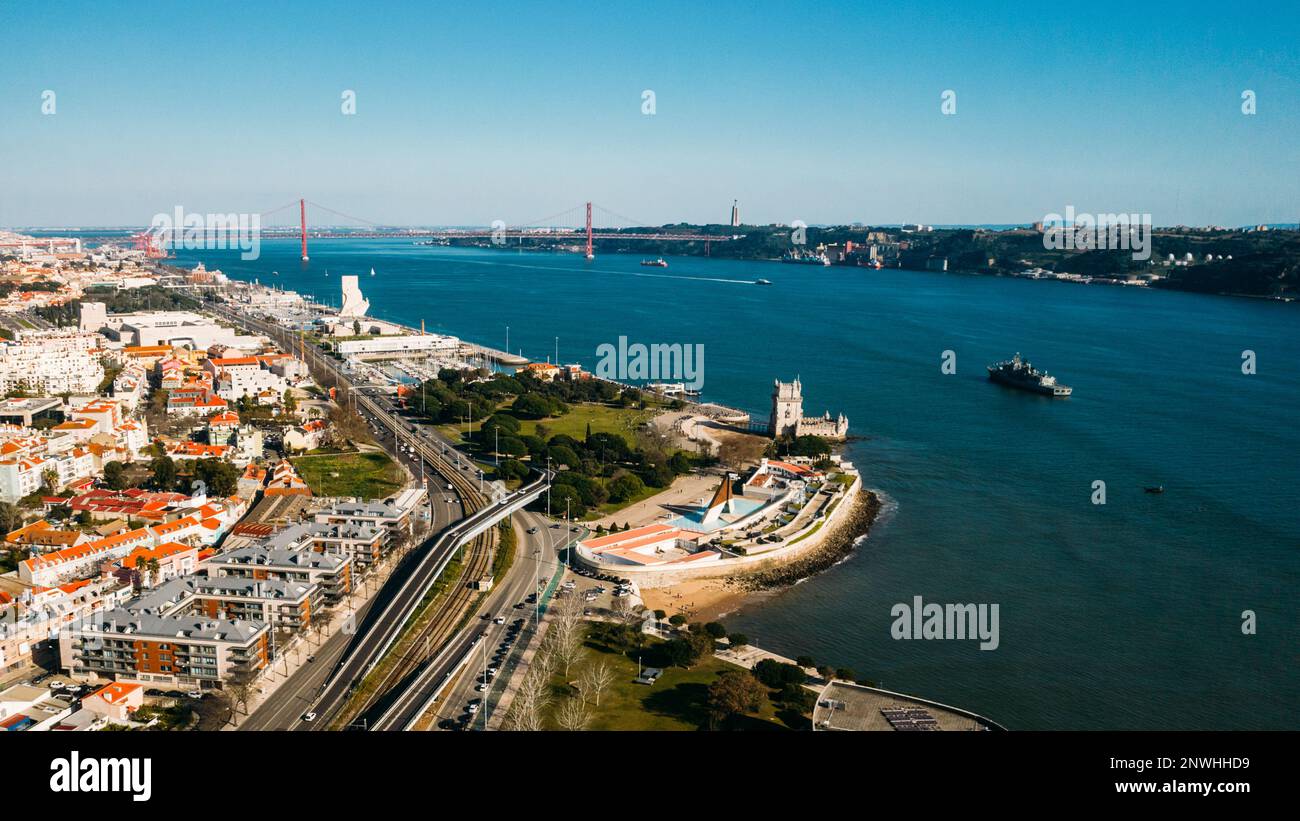 Aerial panoramic view of Belem Tower with Discovery Monument and 25 April bridge in background, Lisbon, Portugal Stock Photo