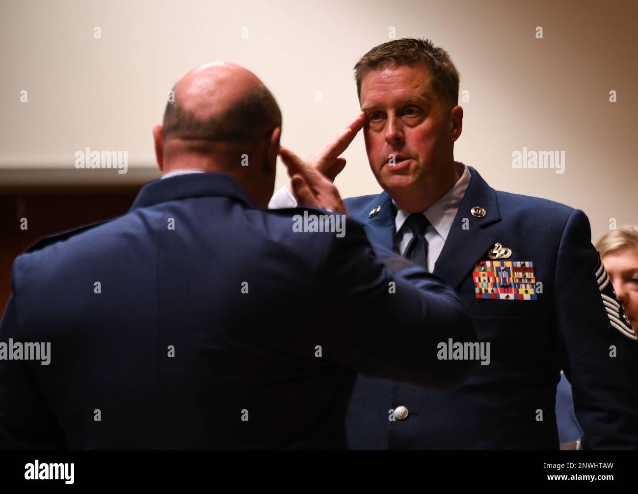 Chief Master Sgt. John Myers renders a salute to Maj. Gen. Barry
