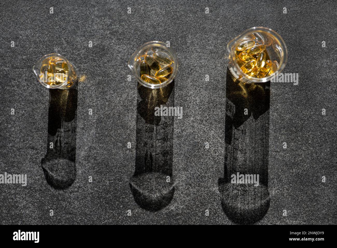 Cod Liver Oil. Omega-3.Fish oil capsules in transparent laboratory ...