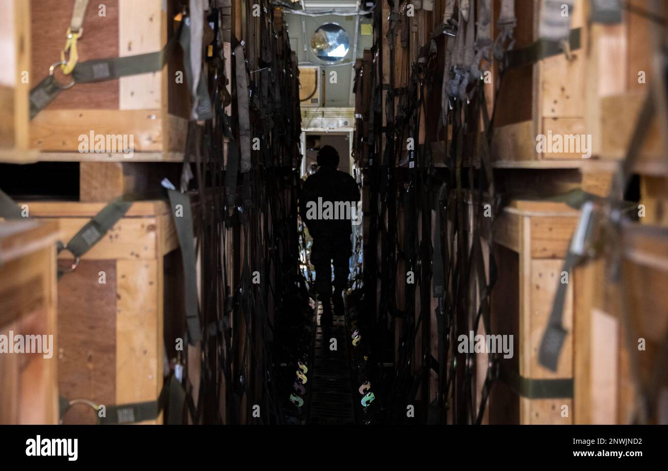 An Airman assigned to the 728th Air Mobility Squadron prepares to transport field hospital tent supplies from a C-17 Globemaster III at Incirlik Air Base, Türkiye, Feb. 22, 2023. The equipment will be used to support the Turkish government’s response to the Feb. 6, 2023, earthquakes. In the aftermath of the earthquakes, U.S. President Joseph R. Biden directed the heads of Federal agencies across the government to rapidly mobilize to assist the Government of Türkiye and humanitarian partners in Syria. The field hospital supplies are being sent across Türkiye to provide humanitarian support to t Stock Photo