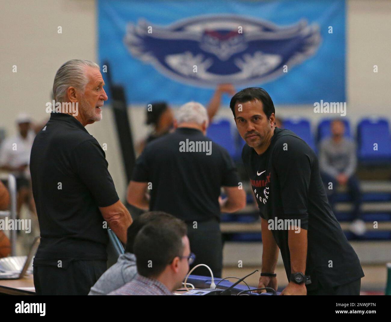 Miami Heat president Pat Riley, left, and head coach Erik Spoelstra talk during NBA basketball
