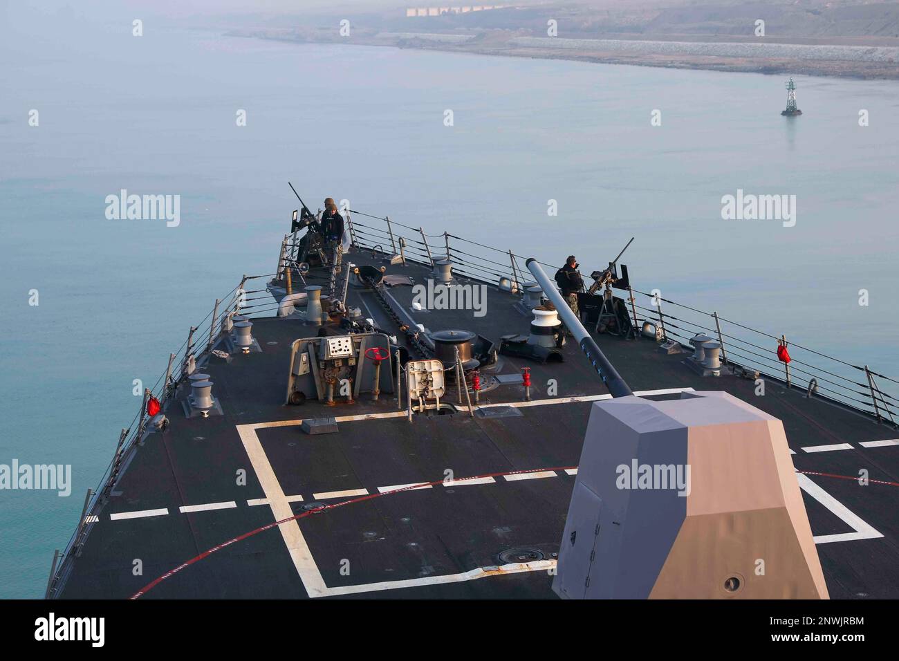 230121-N-JO162-1027 SUEZ CANAL (Jan. 21, 2023) Sailors assigned to the guided-missile destroyer USS Truxtun (DDG 103) stand security force watch during a transit of the Suez Canal, Jan. 21, 2023. Truxtun is deployed to the U.S. 5th Fleet area of operations to help ensure maritime security and stability in the Middle East region. Stock Photo