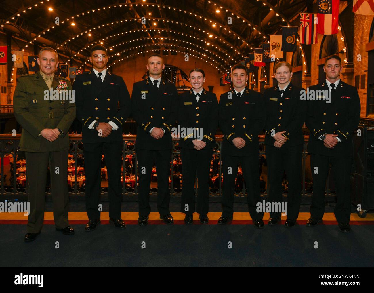 Lt. Gen. Matthew G. Glavy, Deputy Commandant for Information, poses with U.S. Naval Academy midshipmen selected for cyber contracts during the annual U.S. Marine Corps community dinner at Dahlgren Hall Feb 7, 2023. Upon graduation and commissioning as a second lieutenant the U.S. Naval Academy midshipmen will receive orders to The Basic School followed by the Cyberspace Operations Officers Course. Upon completion of their primary military occupational school (PMOS) they will earn the 1702 MOS, Cyberspace Warfare Officer. New Cyberspace Warfare Officers typically fill roles on the Marine Corps' Stock Photo