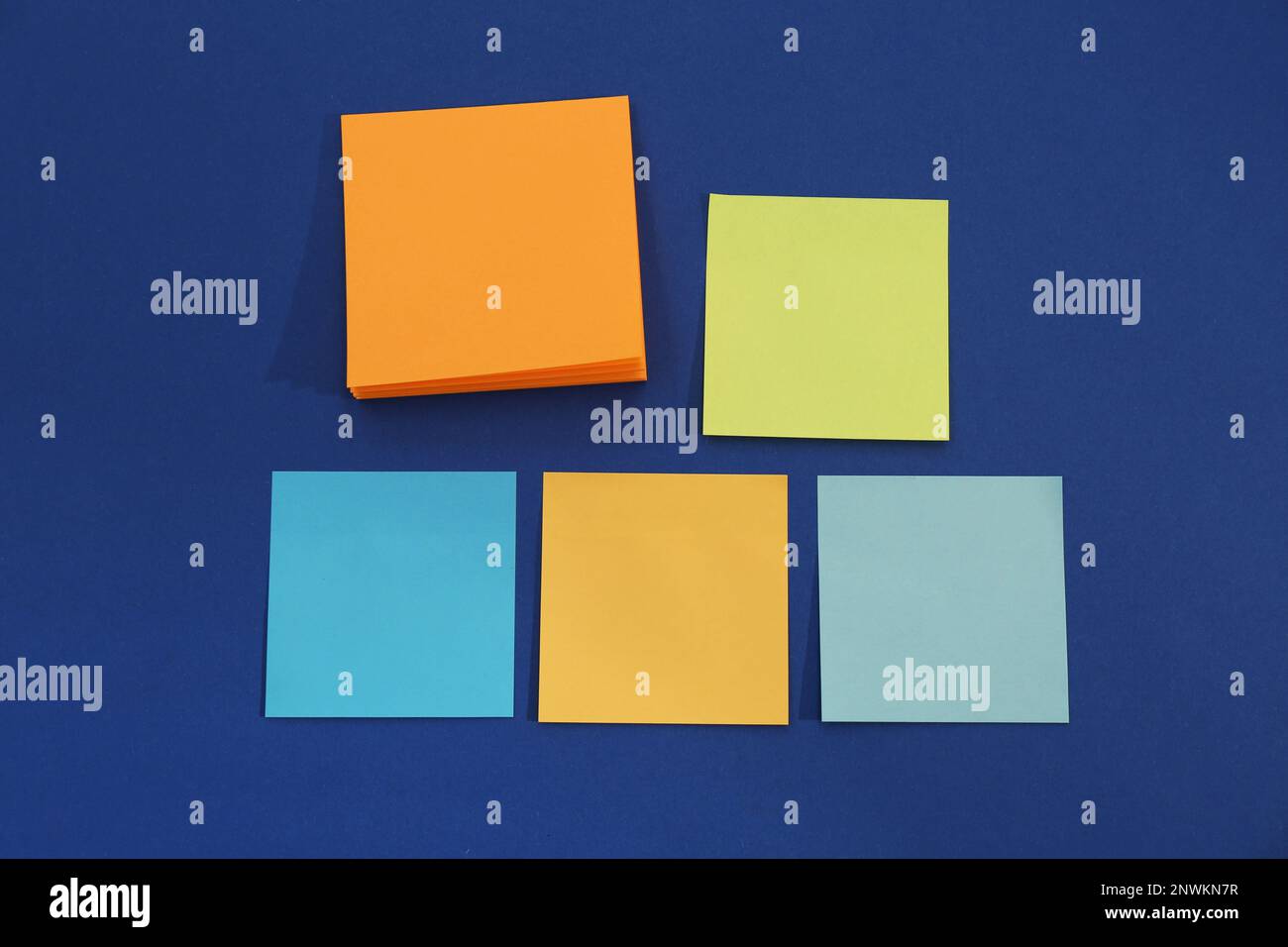 Colorful sticky notes on blue background, flat lay Stock Photo - Alamy
