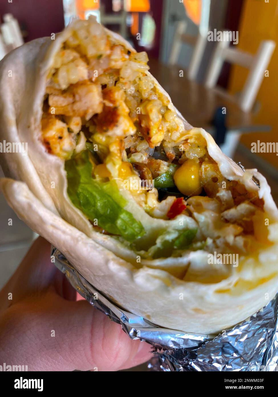 The inside of a chicken burrito served at RockNRoll Burrito, a family