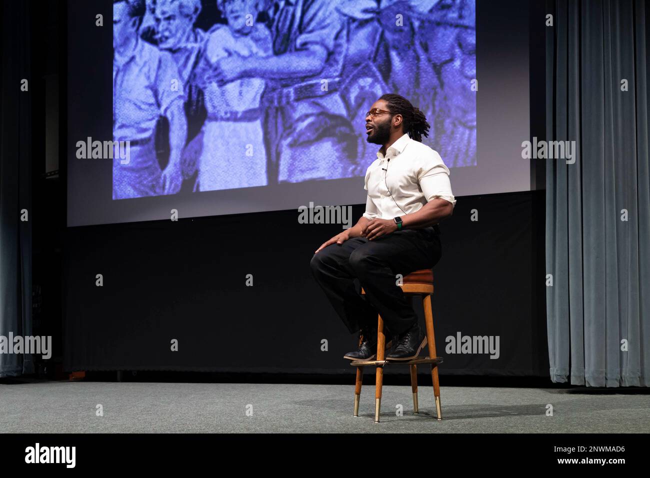 Brian Simmons, performer with “Living Voices”, speaks to the audience during a reenactment of key moments in the Civil Rights Movement during the Dr. Martin Luther King Jr. Commemoration at the U.S. Naval Undersea Museum onboard Naval Base Kitsap- Keyport, Jan. 12. The event honored the legacy of Dr. King and celebrate his accomplishments in combating racial inequality. Stock Photo