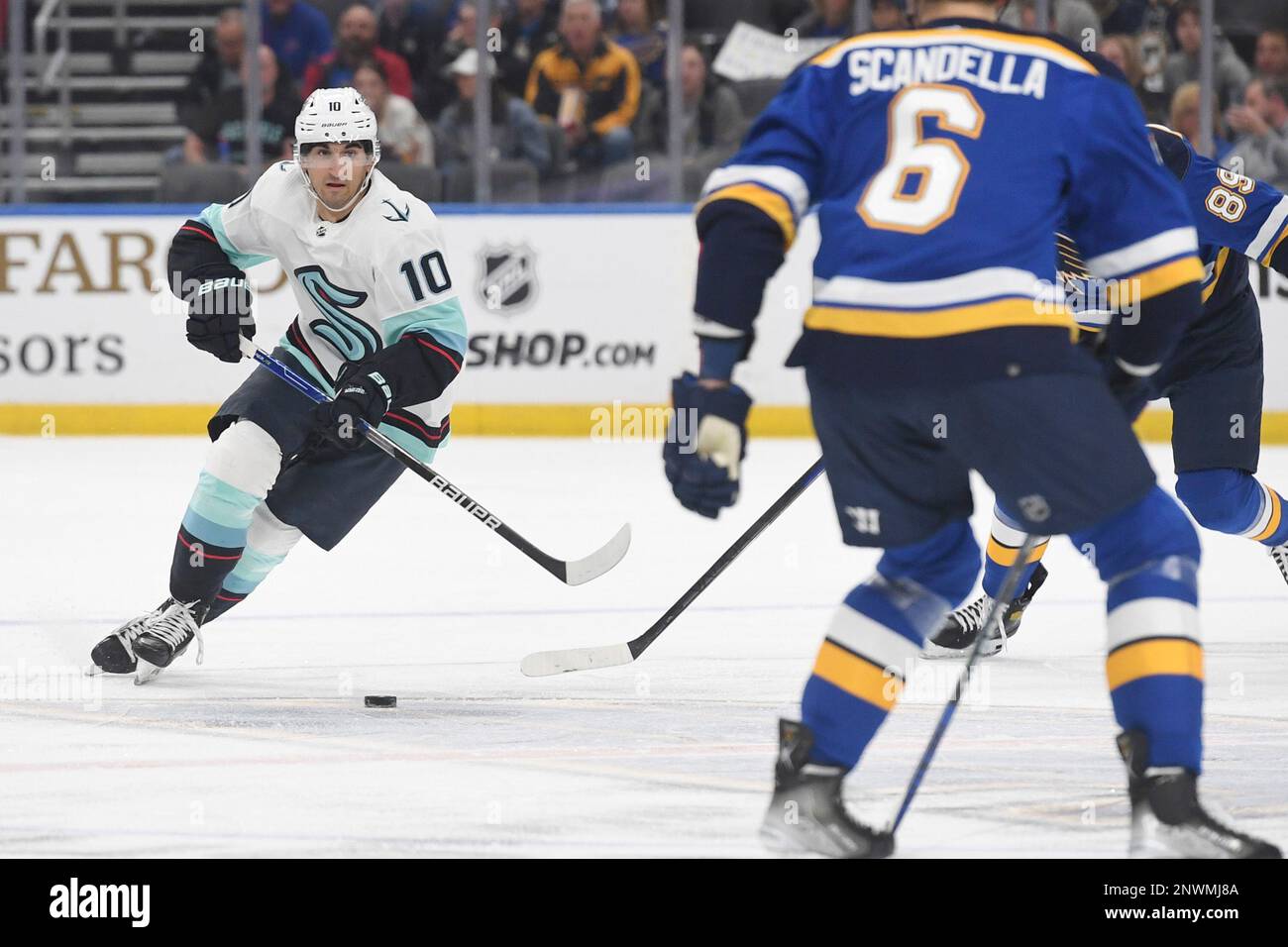 Seattle Kraken' Matty Beniers (10) advances the puck against the St
