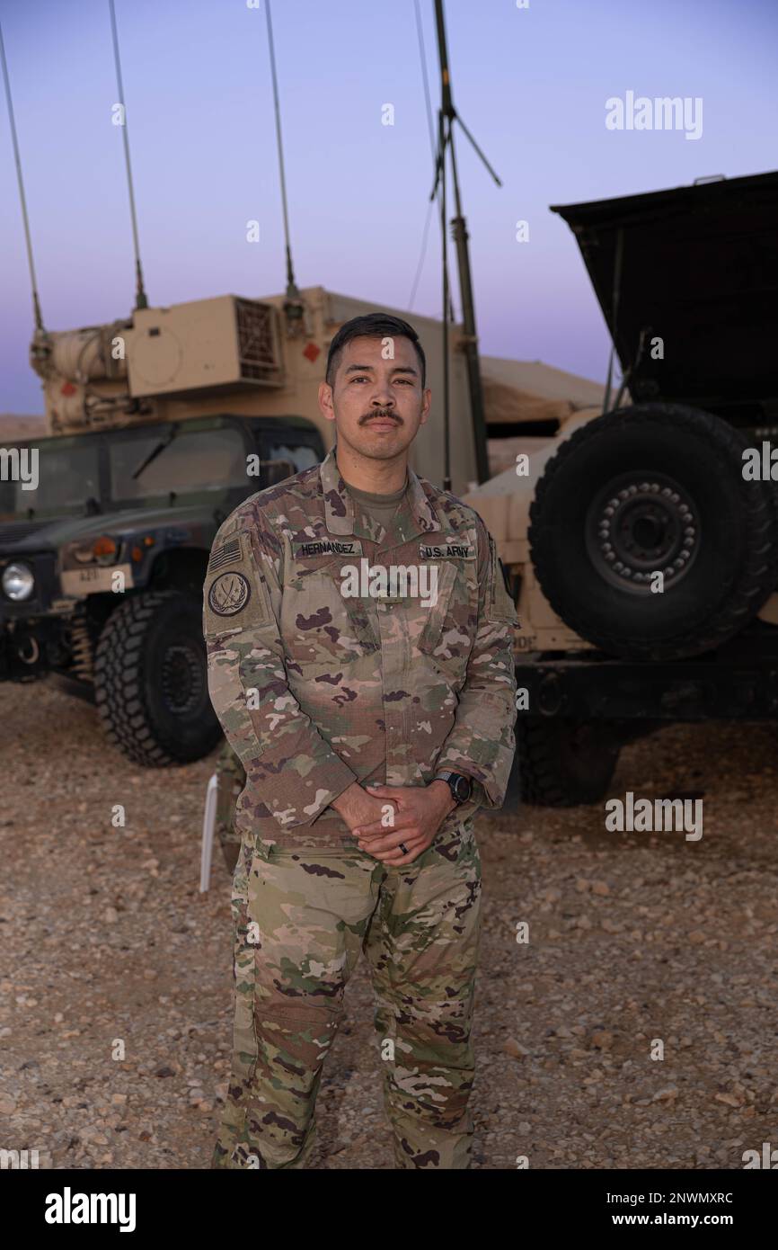 U.S. Army Staff Sgt. Joshua Hernandez, assigned with the 2-130 Field Artillery Regiment (FAR), poses for a portrait as Army Central's (ARCENT) 'Strong Sergeant, Strong Soldier of the Week', at Camp Shivta, Israel, January 24, 2023. Hernandez, a 13J fire control specialist, serves as the section chief for the fire direction center (FDC).  'My grandfather used to say that listening is more valuable than speaking when it comes to mentoring. I've taken this advice to heart and have benefited greatly from listening to my soldiers. Instead of pretending to know everything, I share my knowledge and l Stock Photo