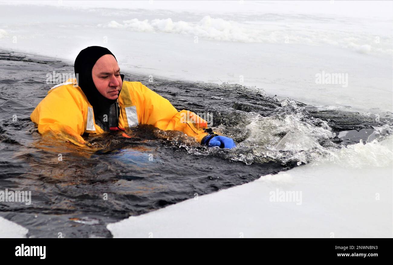A firefighter wearing a cold-water immersion protective suit acts as a ...